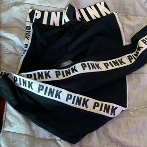 black leggings with pink logo